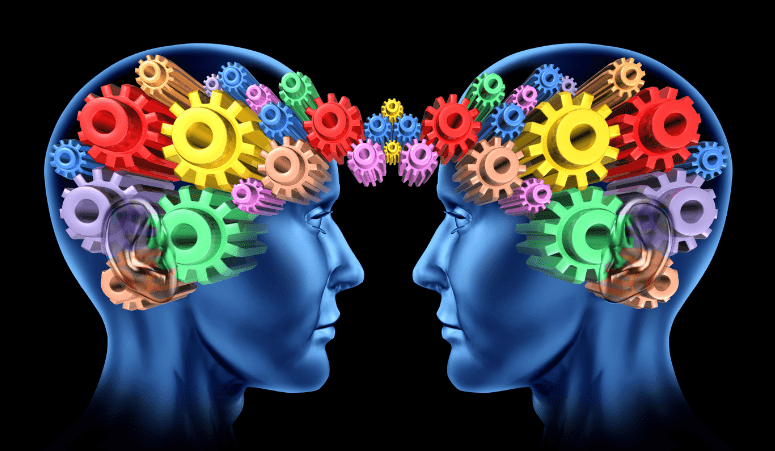 Two heads with gears signifying communication